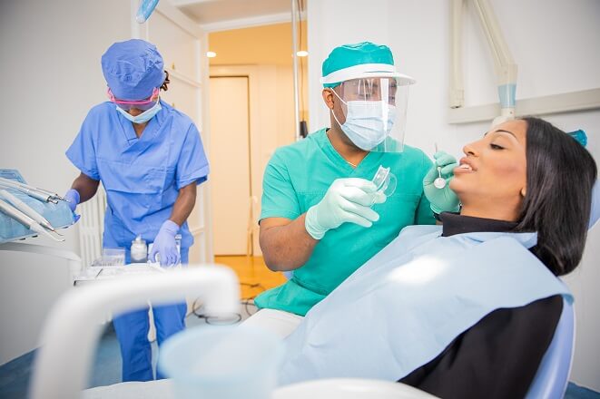 Dental Professional Treating Patient