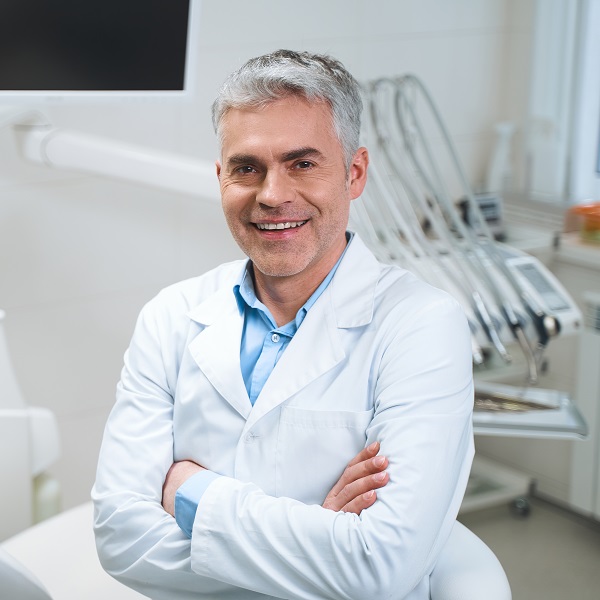 Doctor putting on gloves